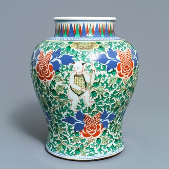 A Chinese wucai 'boys and peony scrolls' vase, 19th C.