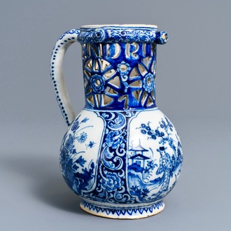 A Dutch Delft blue and white chinoiserie puzzle jug, dated 1743