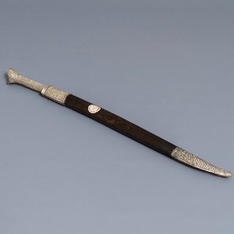 An Ottoman silver-mounted Damascus steel 'yatagan' sword in its leather sheath, Turkey, 19th C.