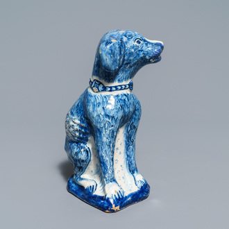 A Dutch Delft blue and white model of a dog, 1st half 18th C.