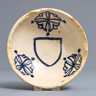 A Spanish blue and white armorial bowl, 16/17th C.