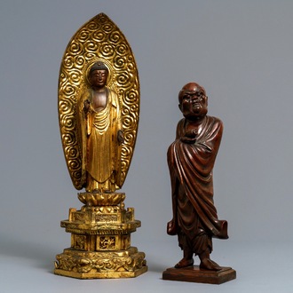 A Japanese giltwood figure of Buddha and a 'Daruma' okimono, Meiji, 19th C.