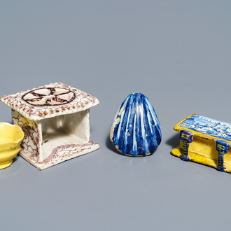 A manganese Dutch Delft miniature stove, a blue and white shell and a French book-shaped handwarmer, 18th C.
