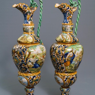 A pair of massive Italian maiolica ewers with figures in landscapes, 19th C.