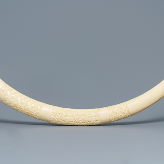 A carved African ivory tusk with ornamental design, Congo, 1st half 20th C.