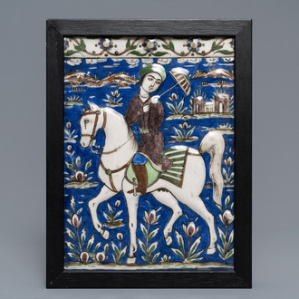 A rectangular Qajar relief-moulded tile with a prince on horseback, Iran, 19th C.