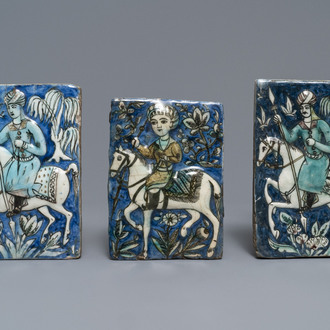 Three Qajar relief-moulded tiles with soldiers on horseback, Iran, 19th C.