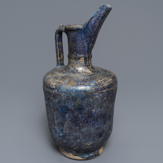 A blue-glazed Islamic pottery jug, Kashan, Iran, 13th C.
