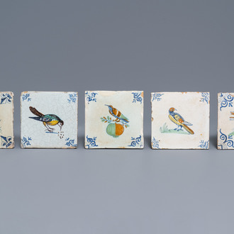 Five polychrome Dutch Delft tiles with birds and a dog, 17th C.