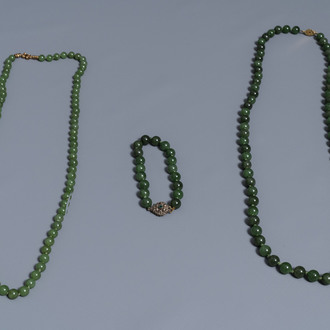 Two Chinese necklaces and a bracelet with spinach green jade beads, 20th C.