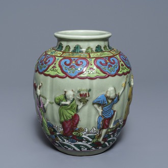 A Chinese relief-decorated famille rose celadon-ground vase, 19/20th C.