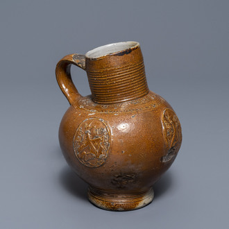 An armorial stoneware jug with unicorns, Raeren, 16/17th C.