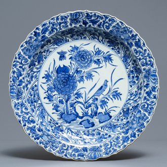 A Chinese blue and white moulded dish with a bird among flowers, Kangxi