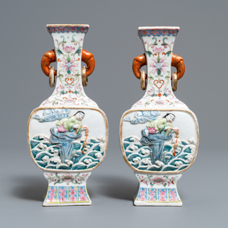 A pair of Chinese famille rose relief-decorated 'Liu Hai' vases, Qianlong mark, 19th C.