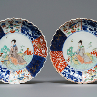 A pair of Chinese verte-Imari plates with a lady in a garden, Kangxi
