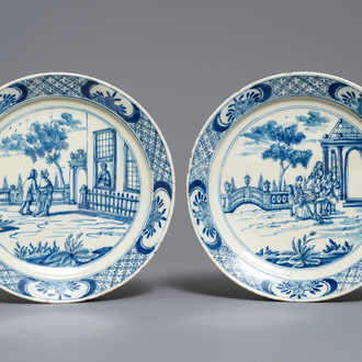 A pair of fine Dutch Delft blue and white 'garden scene' plates, 18th C.