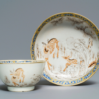 A Chinese grisaille and iron red cup and saucer with deer, Yongzheng/Qianlong