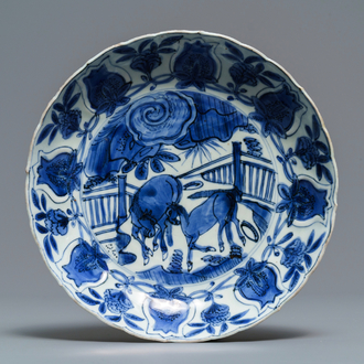 A Chinese blue and white moulded 'two horses' kraak porcelain plate, Wanli