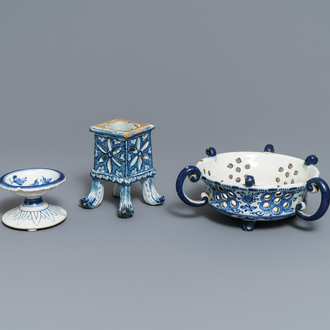 A Dutch Delft blue and white salt, a reticulated stand and a chafing dish, 18th C.