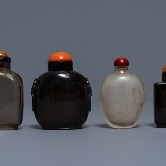 Four Chinese smokey quartz and simulating glass snuff bottles, 18/19th C.