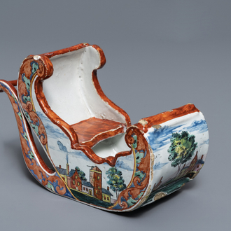 A polychrome petit feu Dutch Delft pipe stand modelled as a sledge, 18th C.