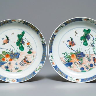 A pair of Chinese famille verte 'ducks in a lotus pond' plates, Kangxi