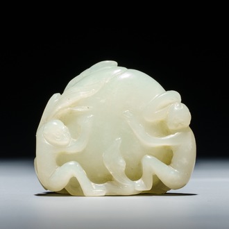 A Chinese celadon jade carving of two monkeys on a peach, 19th C.