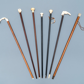 Seven ivory-handled canes, one with freemasonry emblem, 19th C.