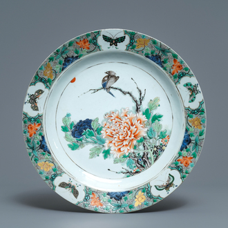 A Chinese famille verte charger with a bird, flowers and butterflies, Kangxi