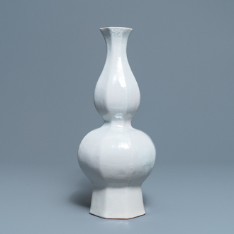 An octagonal white Delftware bottle vase, Dutch or French, 18th C.