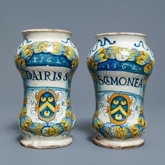 A pair of Italian maiolica armorial albarelli, Deruta, dated 1562