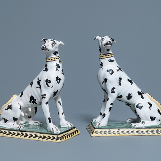 A pair of polychrome Brussels faience models of spotted greyhound dogs, 18th C.