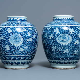 A pair of Chinese blue and white vases with floral design, Kangxi