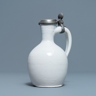 A white Dutch Delft jug with pewter cover, 17th C.