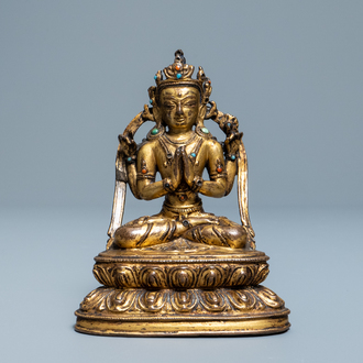 A Sino-Tibetan inlaid gilt bronze figure of Buddha, Ming