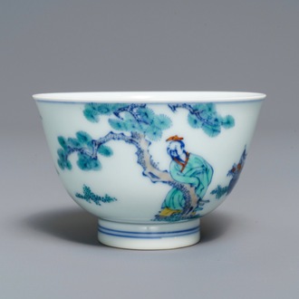 A Chinese doucai bowl with figures in a landscape, Kangxi mark, 19/20th C.