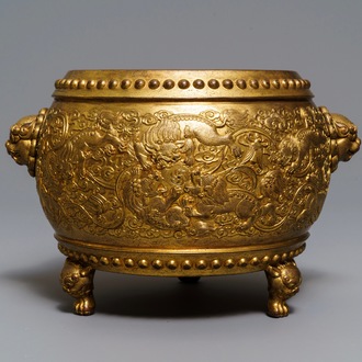 A Chinese gilt bronze tripod censer with buddhist lions, Qianlong mark, 19/20th C.