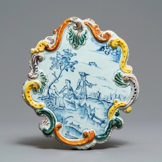 A Dutch Delft blue and white mixed technique border plaque, 18th C.