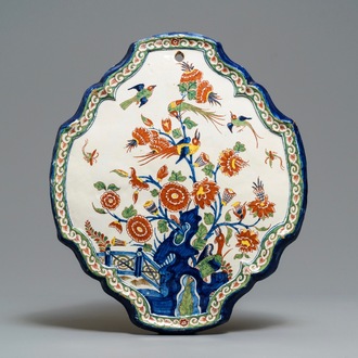 A Dutch Delft cashmere palette plaque with birds and insects among flowers, 18th C.