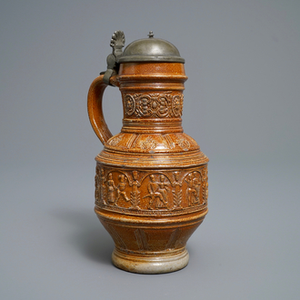 A 'Peasants dance' stoneware jug with pewter lid, Raeren, dated 1578
