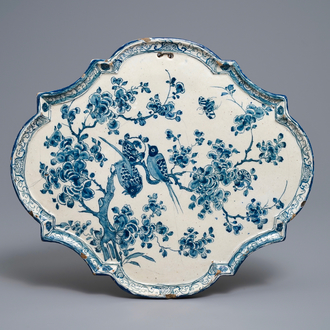 A Dutch Delft blue and white plaque with birds on flowery branches, 18th C.