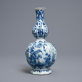 A ribbed Dutch Delft blue and white double gourd vase, early 18th C.