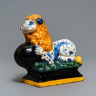 A black-enhanced polychrome Dutch Delft model of a lion, 1st half 18th C.