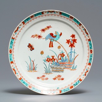 A Dutch Delft doré Kakiemon-style plate with a parrot, early 18th C.