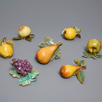 Seven polychrome Dutch Delft models of apples, grapes and pears, 18th C.