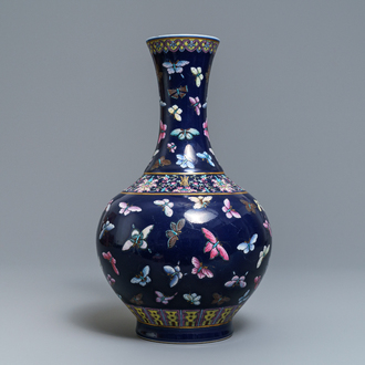 A Chinese blue-ground bottle vase with overglaze butterfly design, Guangxu mark, 19/20th C.