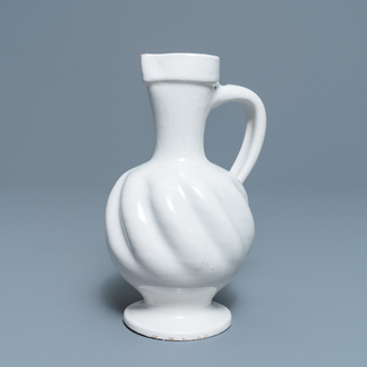 A white Dutch Delft gadrooned jug, 17th C.