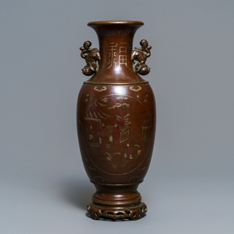 A Chinese or Vietnamese silver-inlaid and inscribed bronze vase, 19th C.