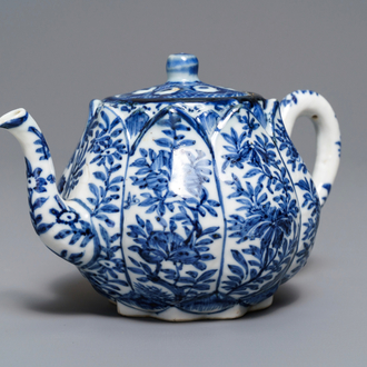 A Chinese blue and white relief-moulded 'lotus flower' teapot and cover, Kangxi