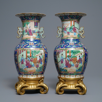 A pair of Chinese Canton famille rose vases with gilt bronze mounts, 19th C.